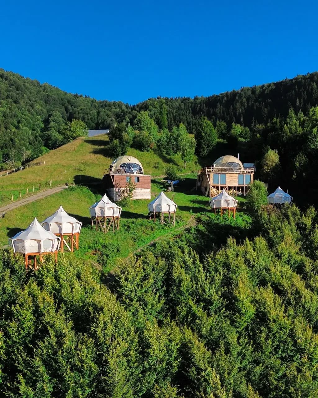 Tents and domes on the mountain ridge
